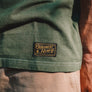 Moss green hemp T-shirt woven label close-up