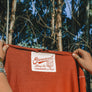 hand-dyed red hemp T-shirt screen printed label