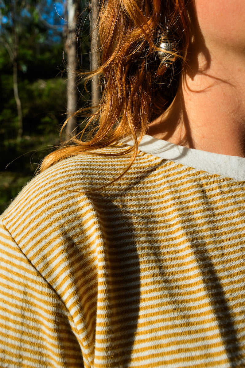 Yellow striped hemp long sleeve fabric close up