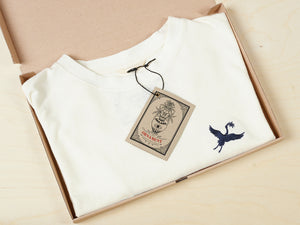 Sustainable Hemp T-shirt with blue crane bird embroidery on chest in recycled box