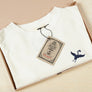 Sustainable Hemp T-shirt with blue crane bird embroidery on chest in recycled box