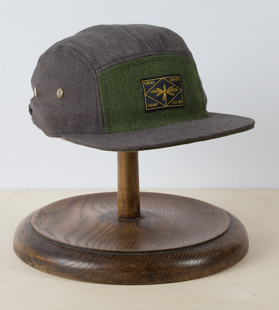 Hemp 5 panel cap in brown and green with woven label hemp plant