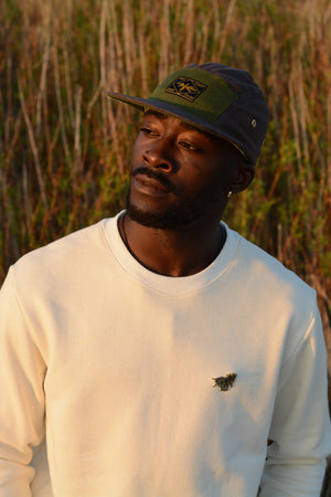 Hemp 5 panel cap in brown and green on male model
